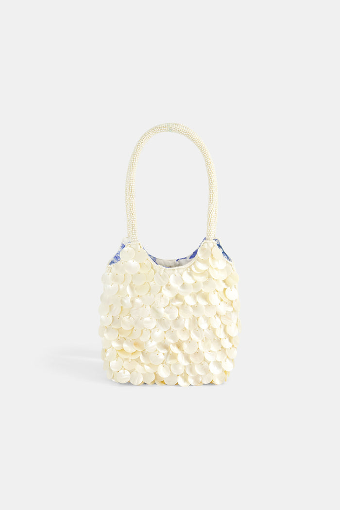 Handbag made of pearls on a white background