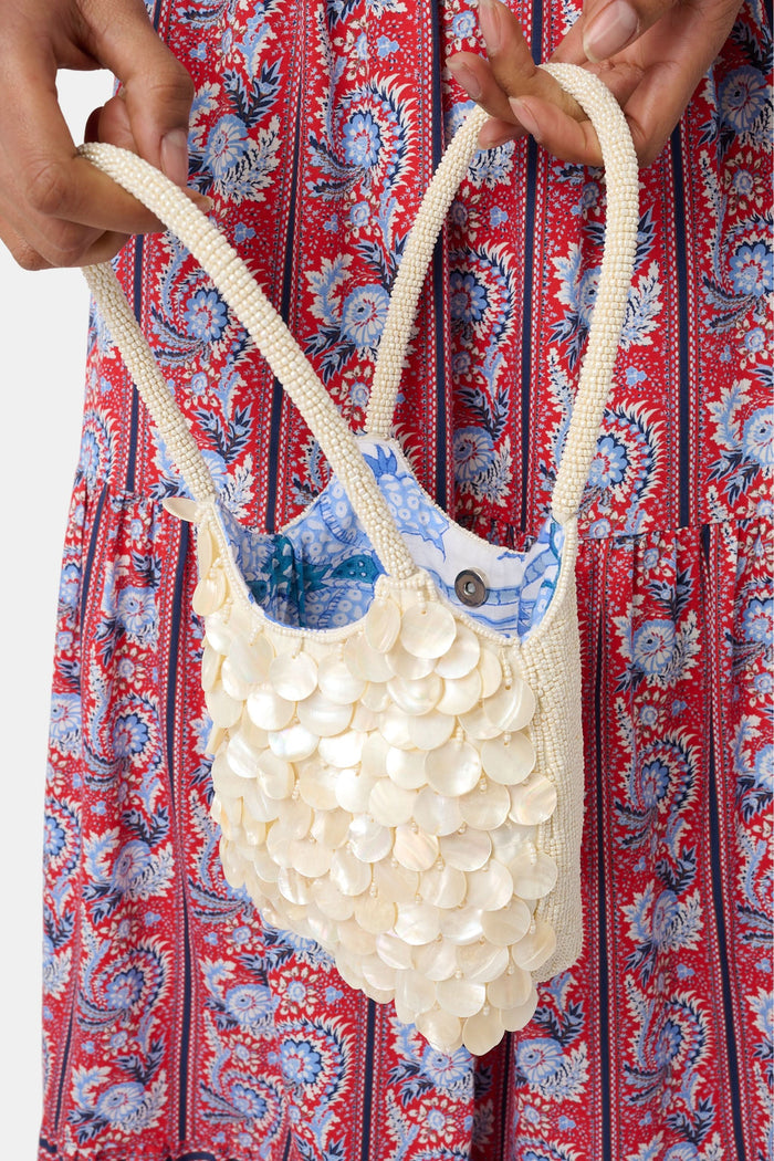 Handbag made of pearls on a white background