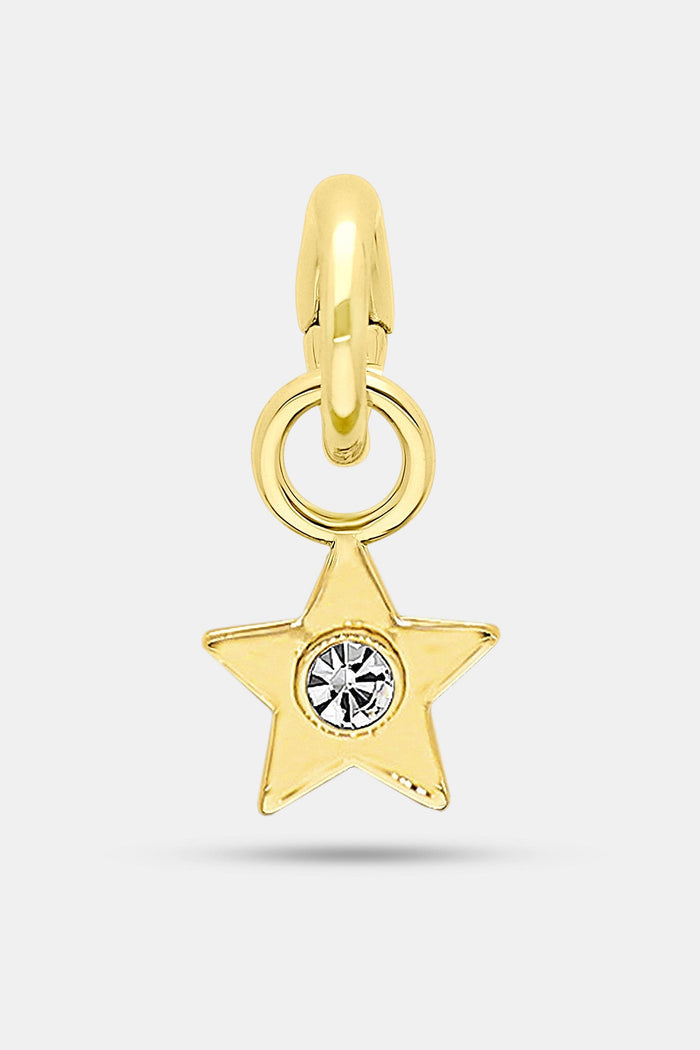 The Roller Rabbit Star Charm features a gold imitation star with a clear center gemstone, attached to a rounded gold loop—ideal for your charm bar collection. Displayed on a plain light gray background.