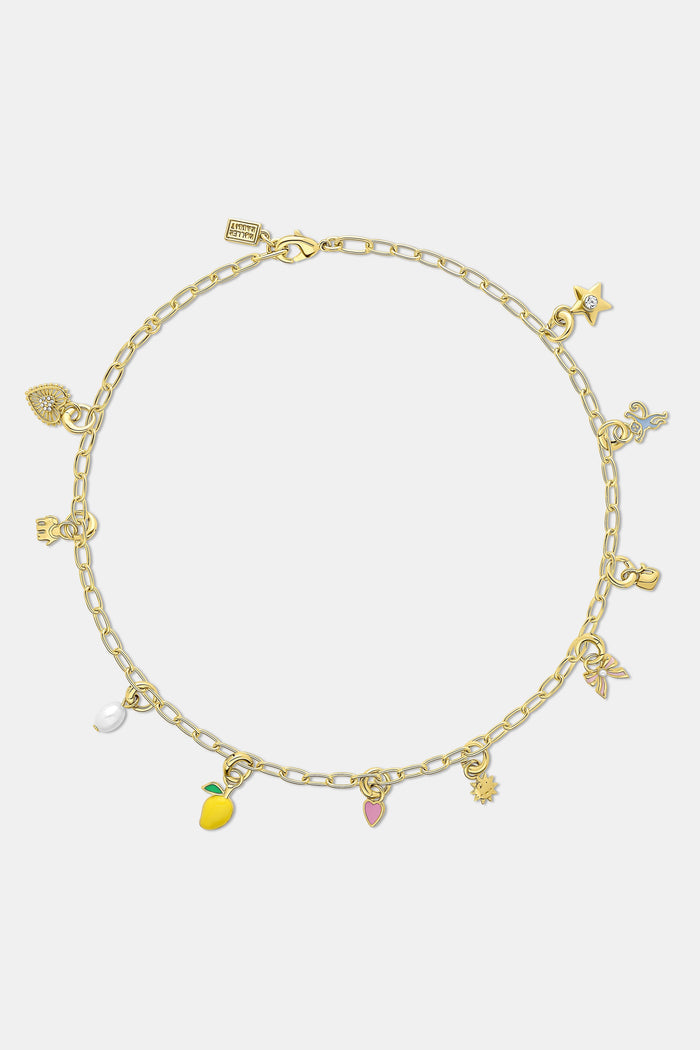 The Roller Rabbit Star Charm features a gold imitation star with a clear center gemstone, attached to a rounded gold loop—ideal for your charm bar collection. Displayed on a plain light gray background.